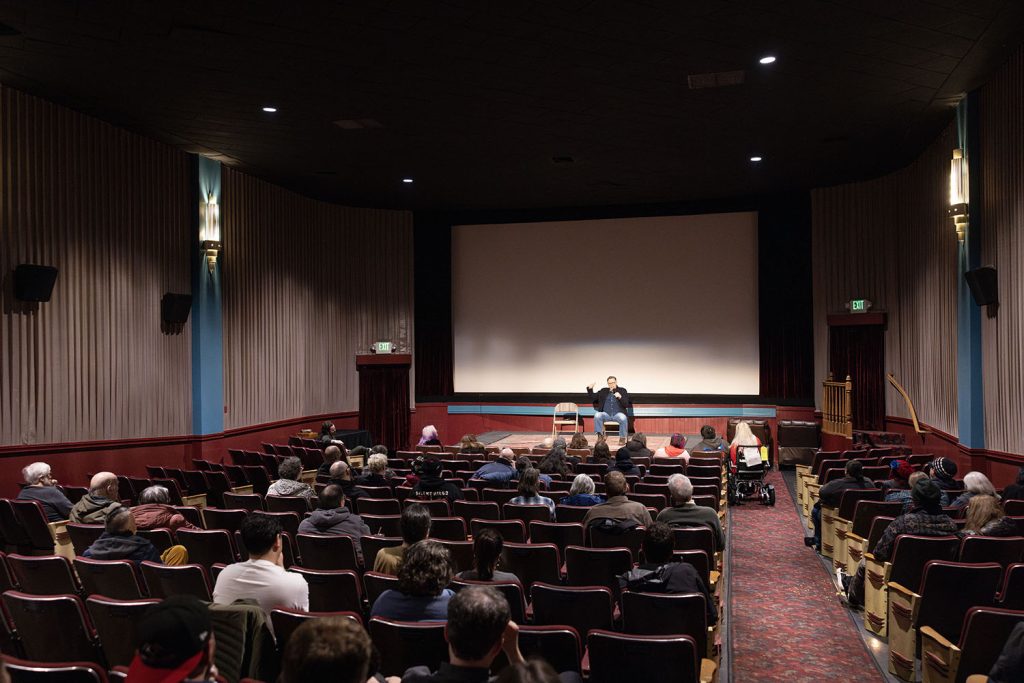 Richard Green speaking to the theatre attendees