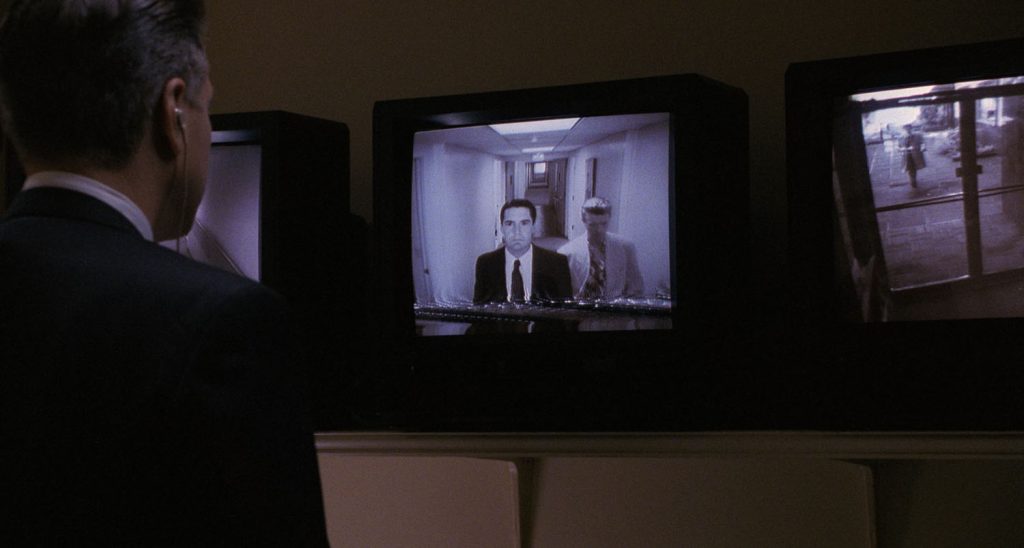 Gordon Cole looking at monitor