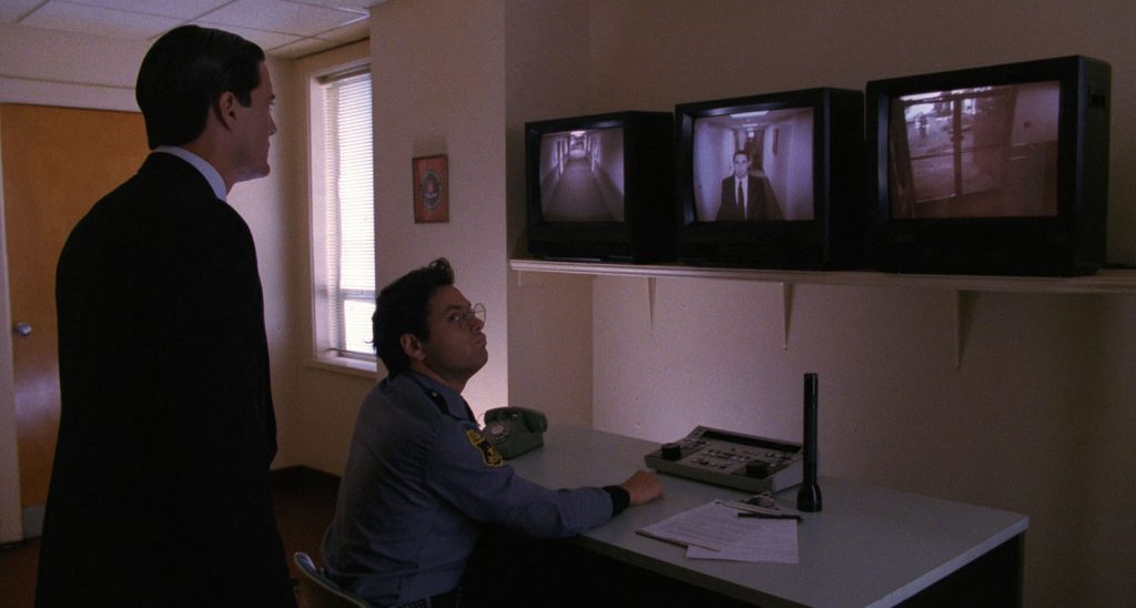 Guard looking at screens