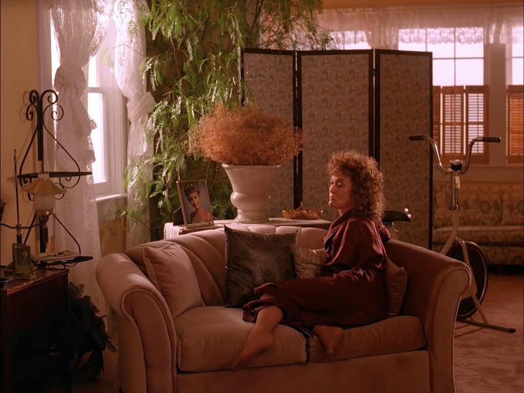 Sarah Palmer sitting on a couch