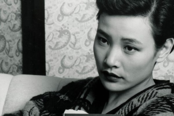Joan Chen as Josie Packard sitting on a couch