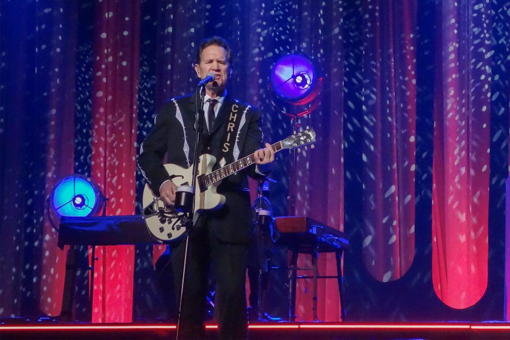 Chris Isaak performing on stage