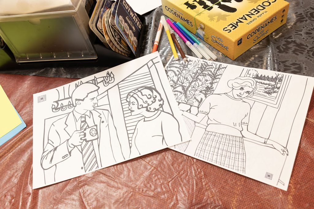 Black and white coloring sheets on a table