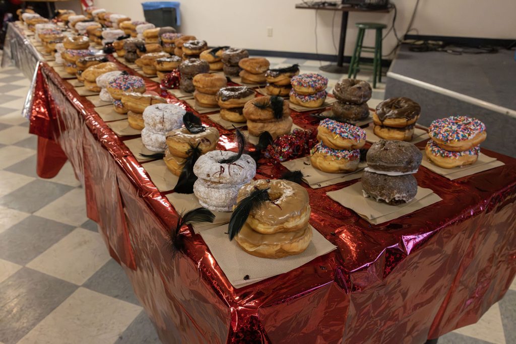Table full of stacked doughnuts