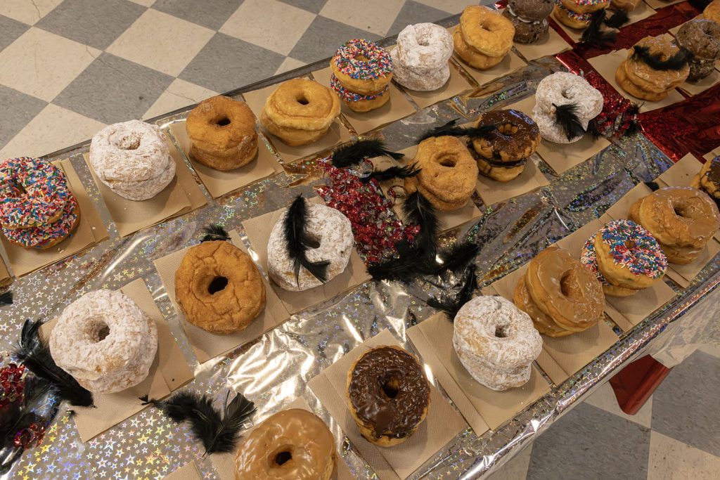Table full of stacked doughnuts