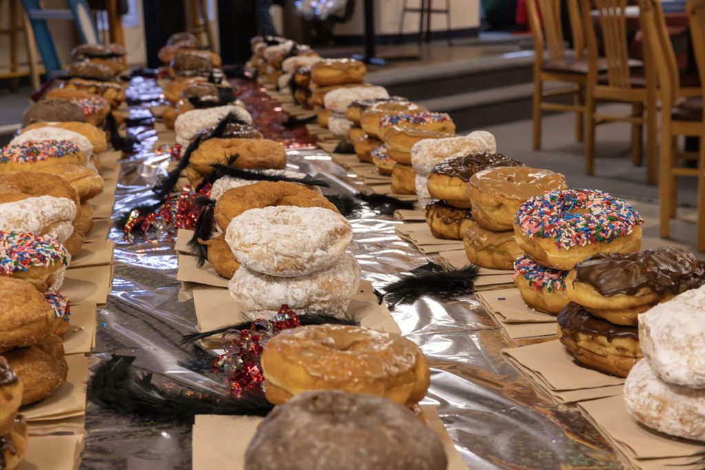 Table full of stacked doughnuts