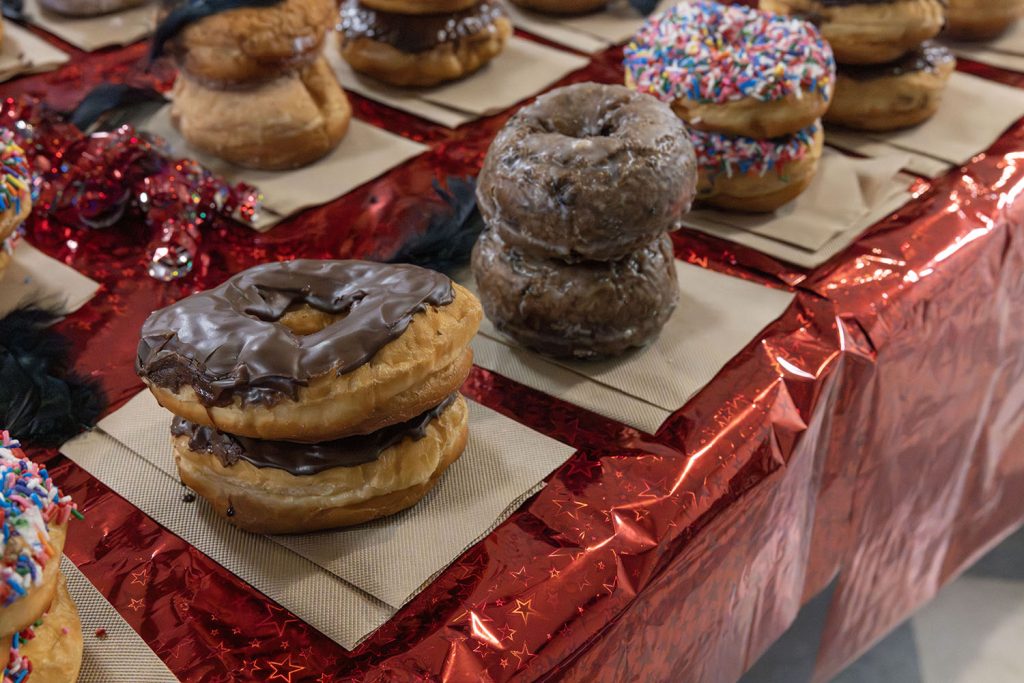 Table full of stacked doughnuts