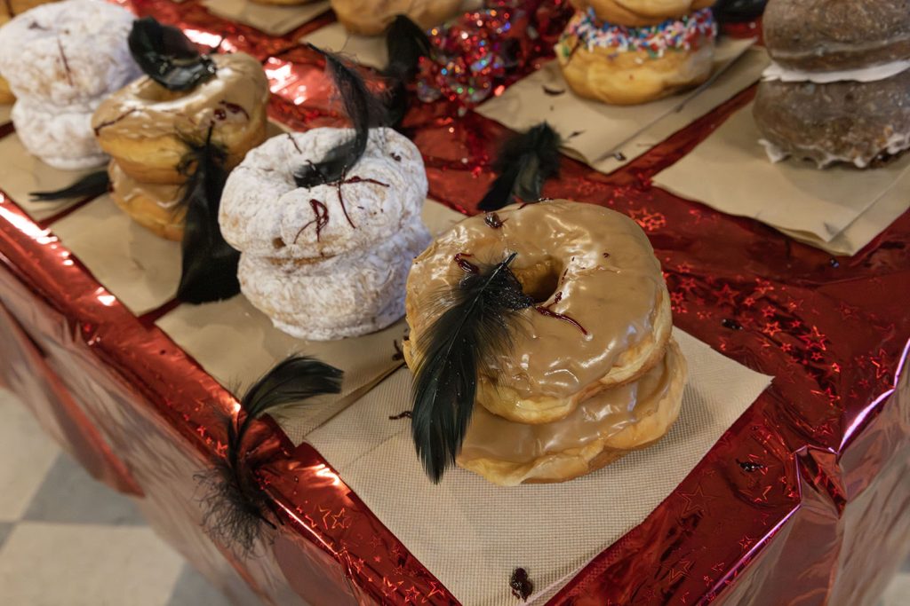 Table full of stacked doughnuts