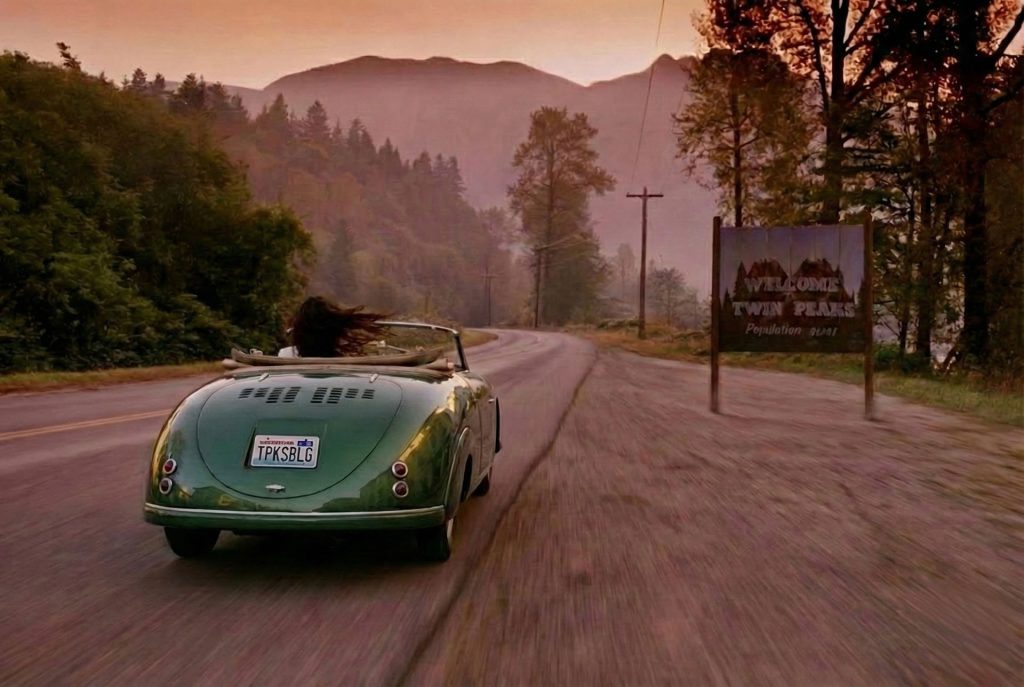 Asami driving her green car into Twin Peaks