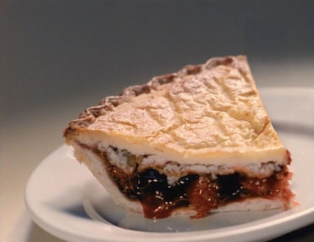 Slice of cherry pie on a plate