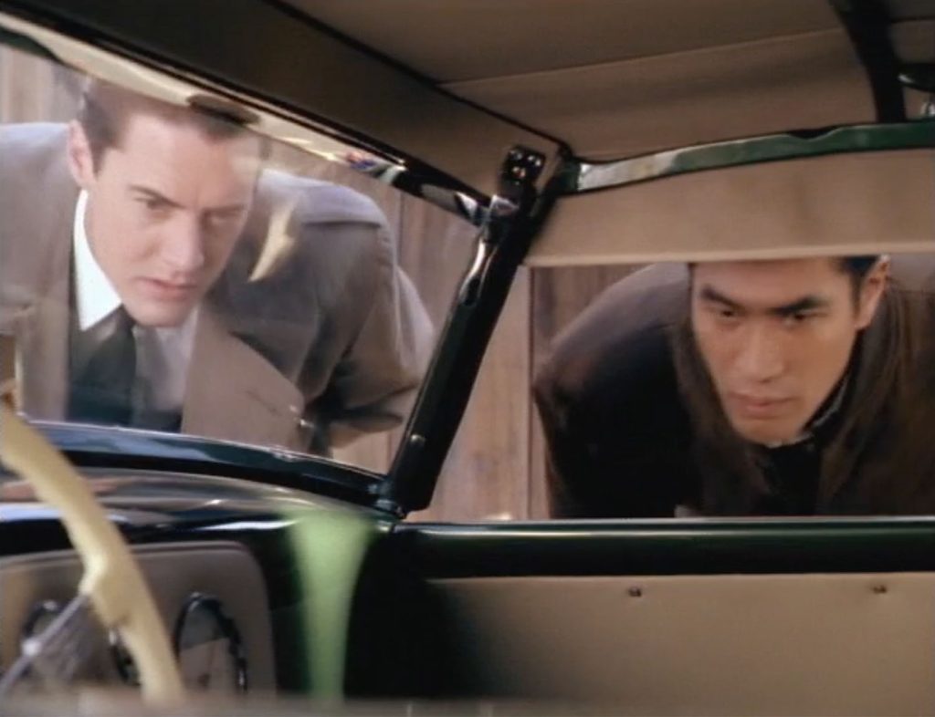 Cooper and Ken look inside car