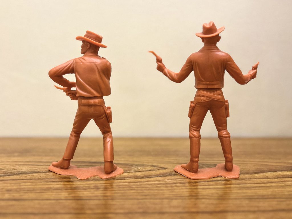 Back of cowboy figures