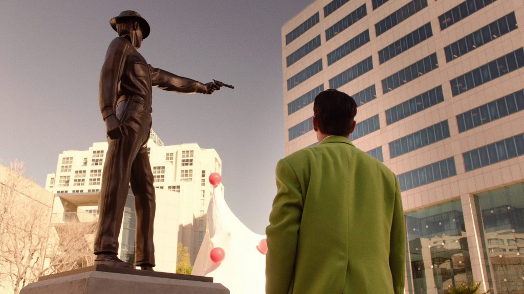 Dougie Jones looking at cowboy statu