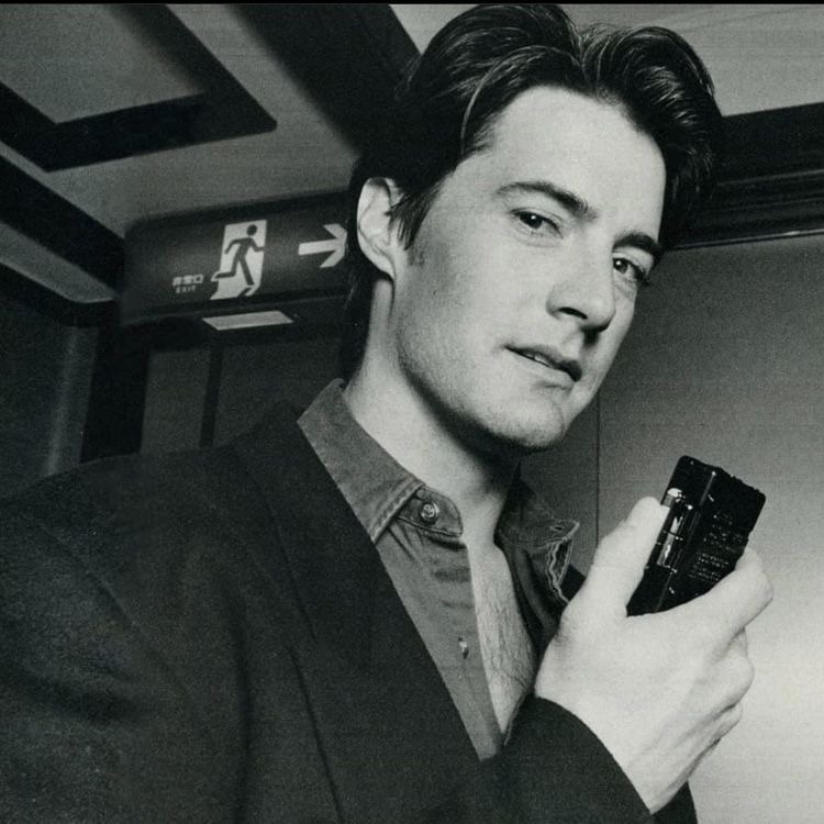 Kyle MacLachlan holding a tape recorder
