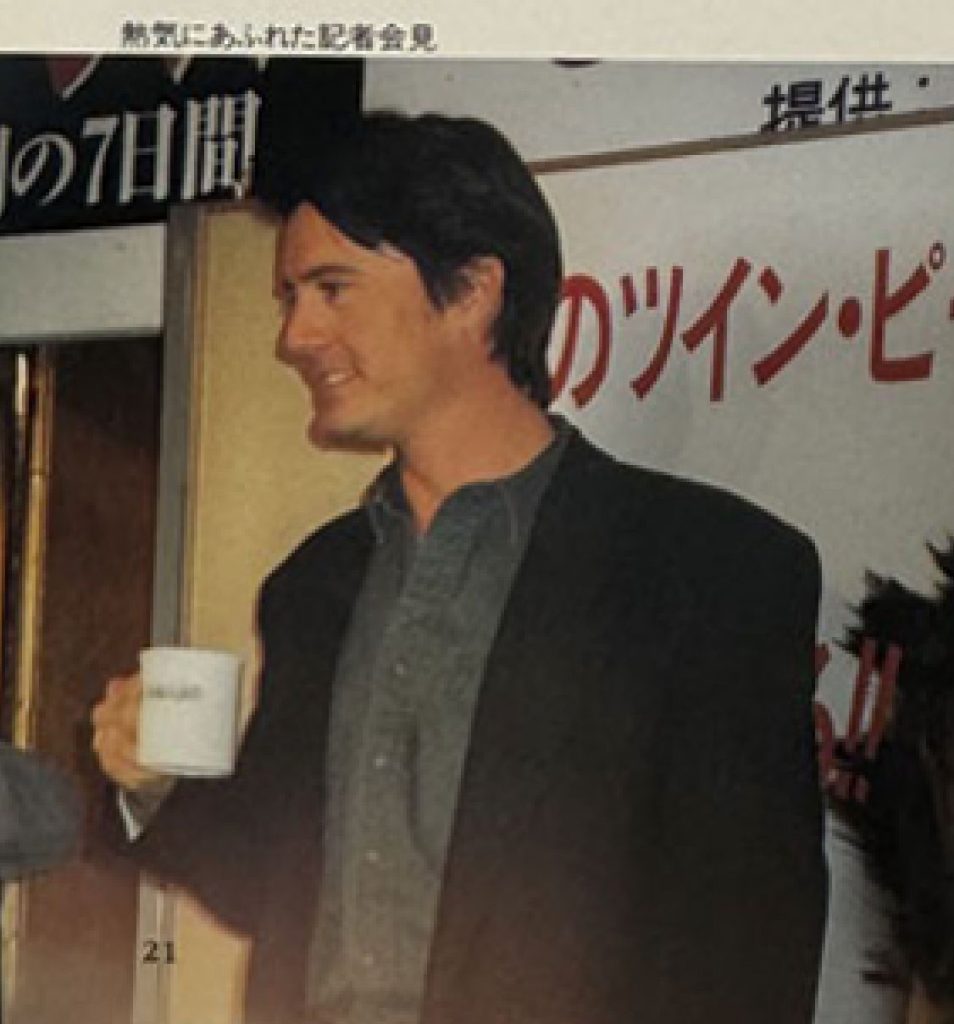 Kyle MacLachlan holding coffee mug