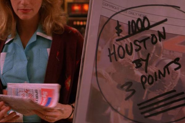 Norma Jennings holding newspaper