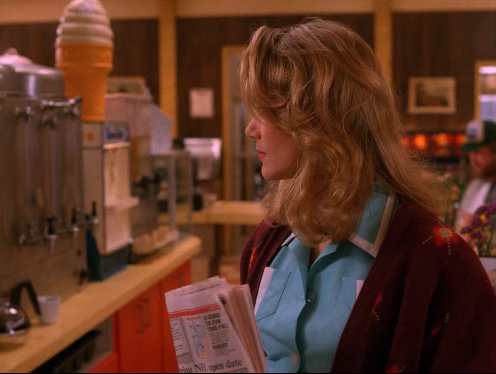 Norma Jennings holding a newspaper