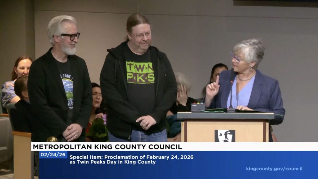 District 3 Councilmember Sarah Perry speaking while Steven and Karl look on