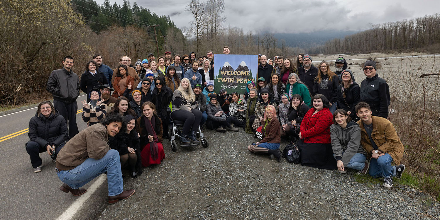 Group of Twin Peaks Fans by the Welcome to Twin Peaks sign