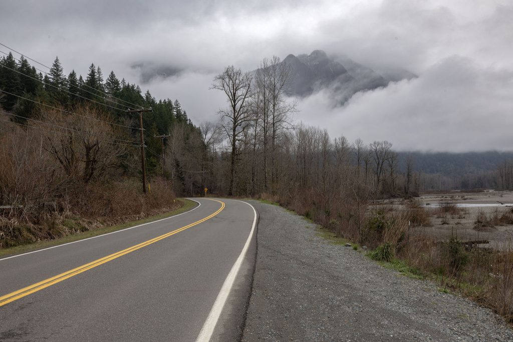 Reinig Road with Mount Si in the distance covered by clouds