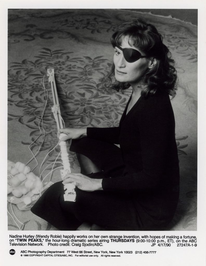 Nadine Hurley (Wendy Robie) with drape runner