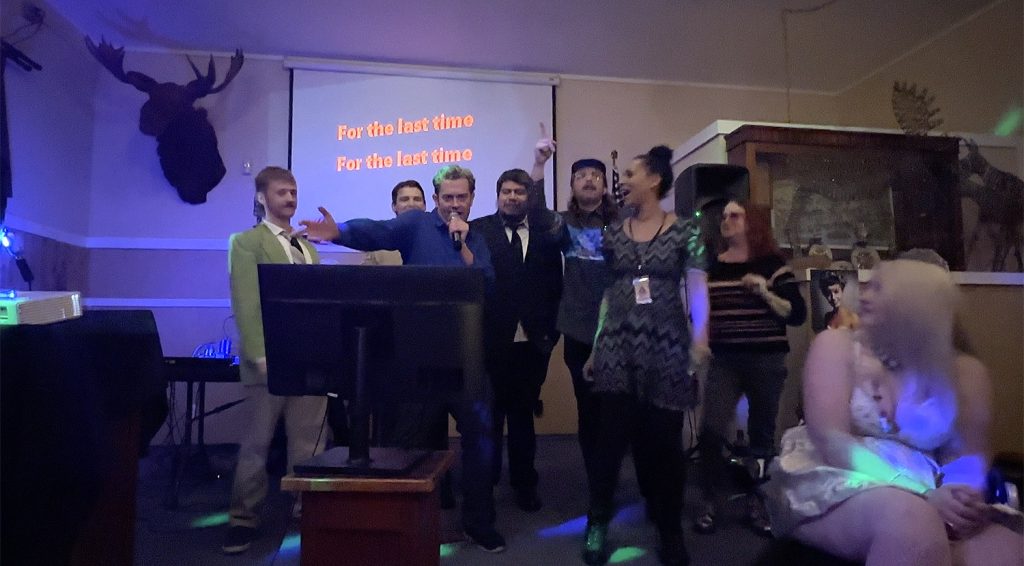 Group of people singing Shadow