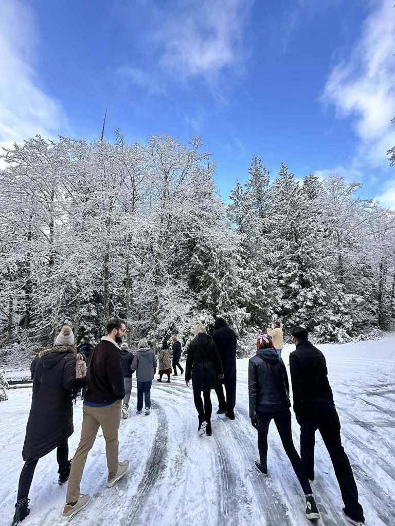 People walking through the snow