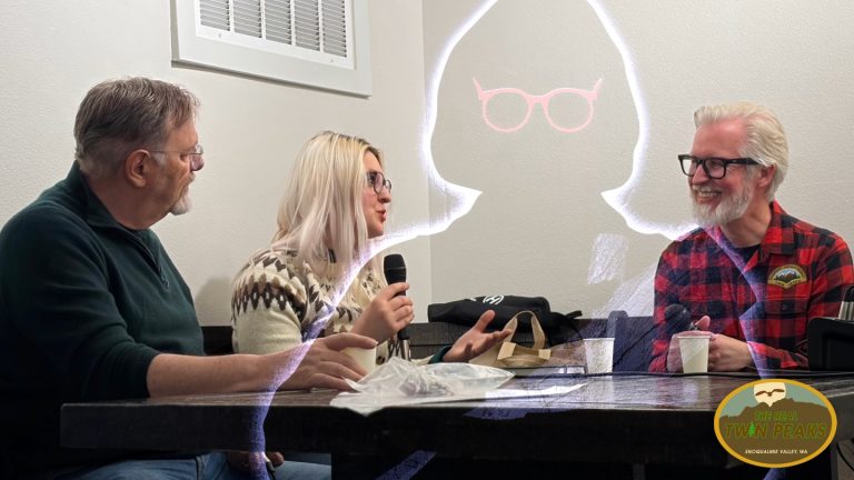 Richard Green, Alex Shurun and Steven Miller at a table with a drawing of Catherine Coulson as the Log Lady floating in the background