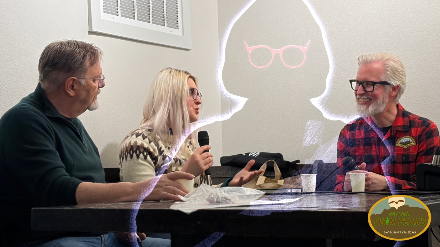 Richard Green, Alex Shurun and Steven Miller at a table with a drawing of Catherine Coulson as the Log Lady floating in the background
