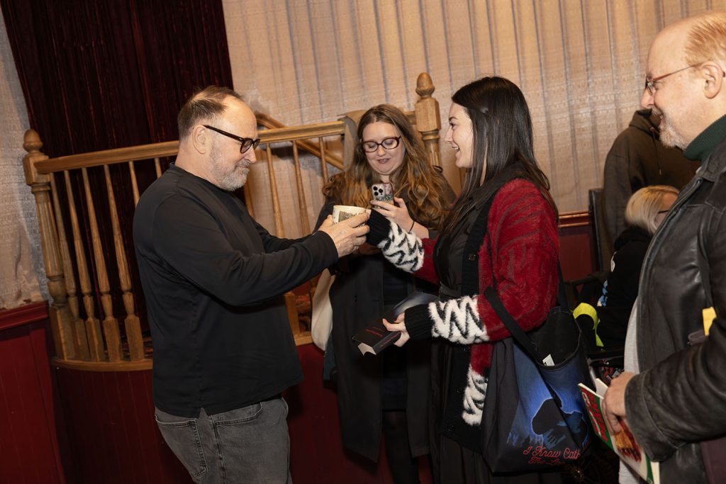 Harley Peyton receiving a mug