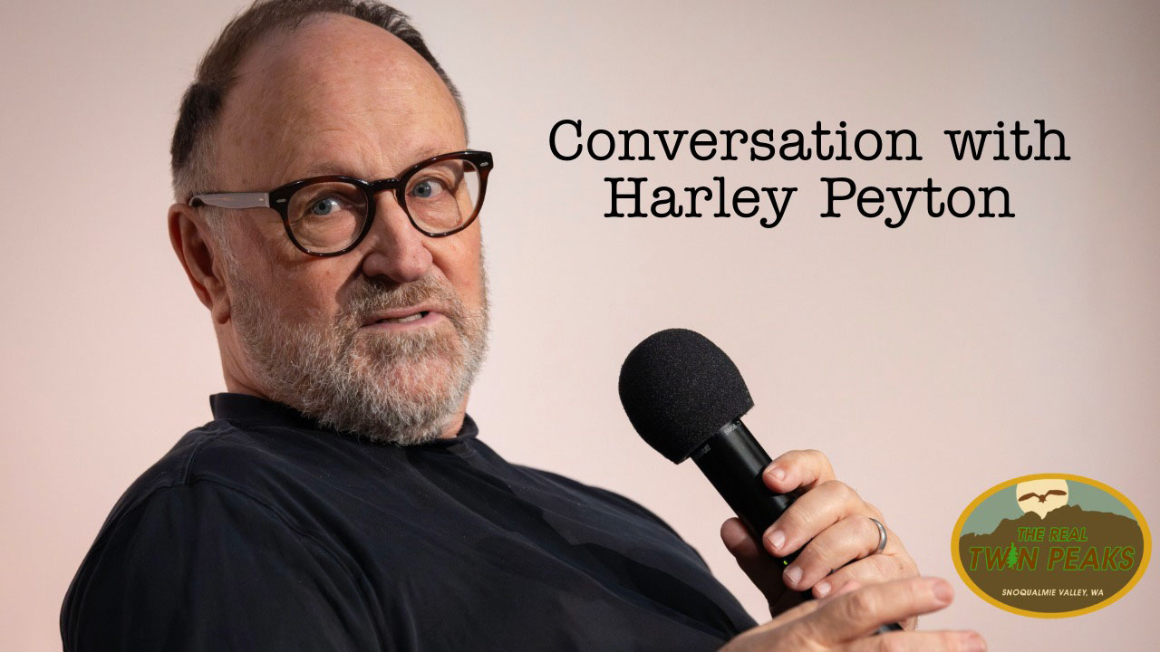 Harley Peyton on stage holding a microphone