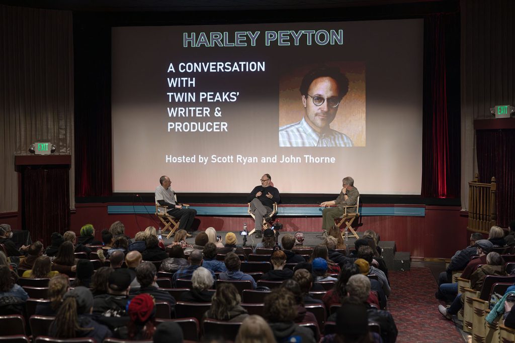 Scott Ryan, Harley Peyton and John Thorne on stage