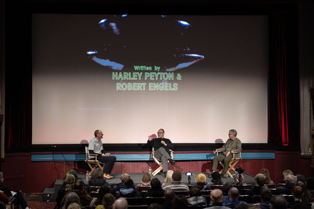 Scott Ryan, Harley Peyton and John Thorne on stage