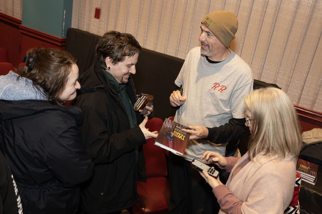 Scott Ryan signing books