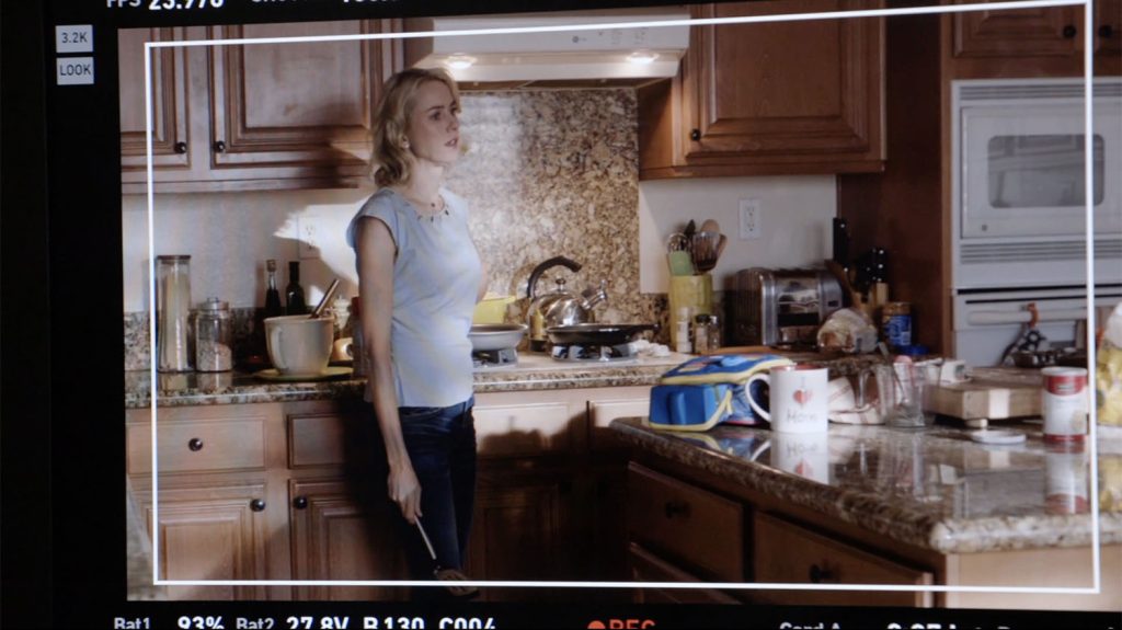 View of a monitor looking at Janey-E in her kitchen