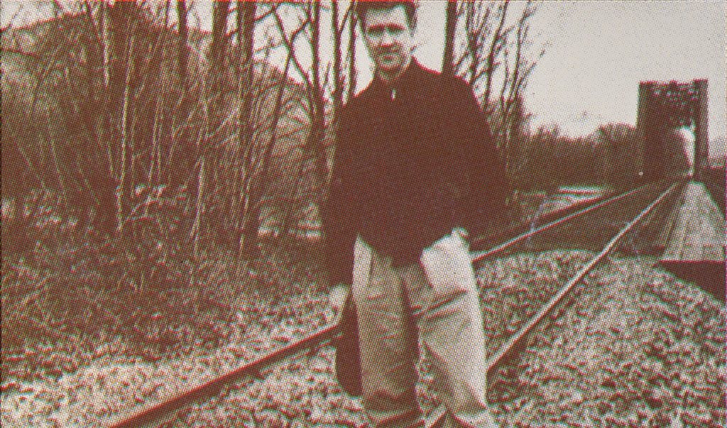 David Lynch standing on a railroad track