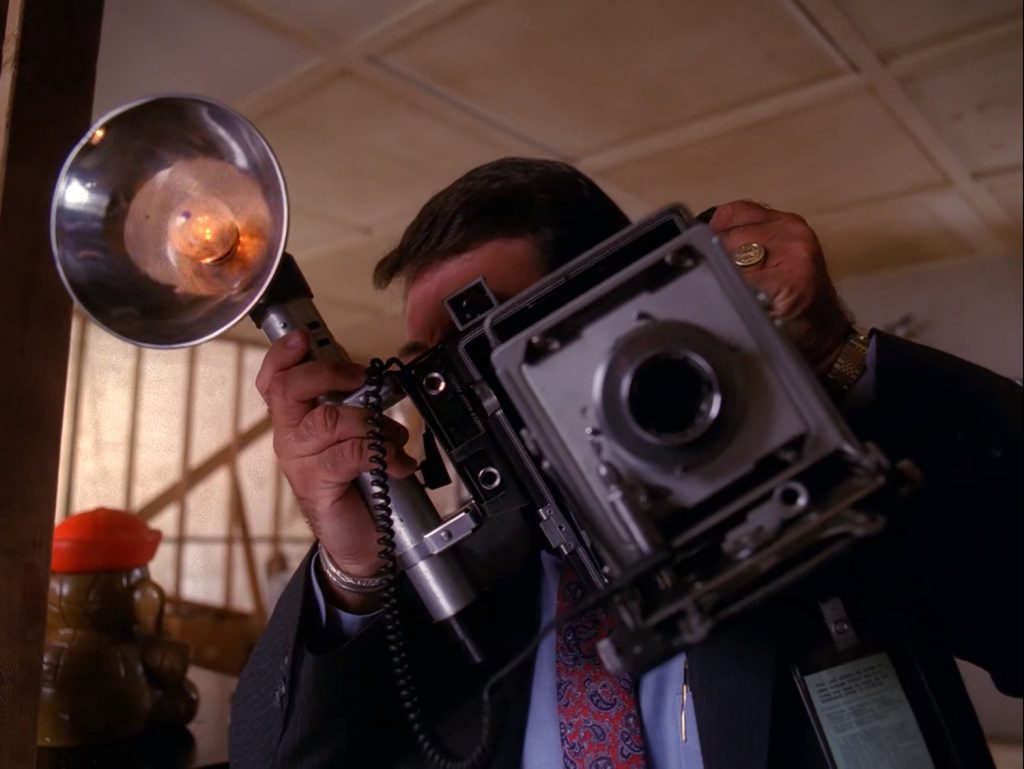 Crime Scene Investigator asking about camera