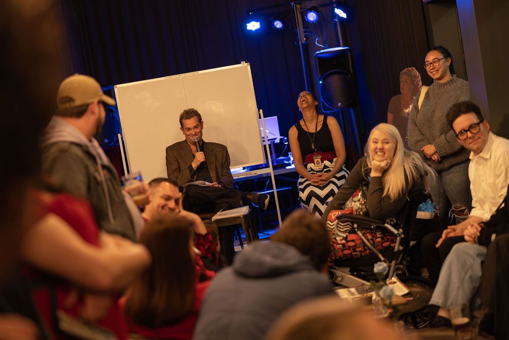 Everyone laughing while playing trivia