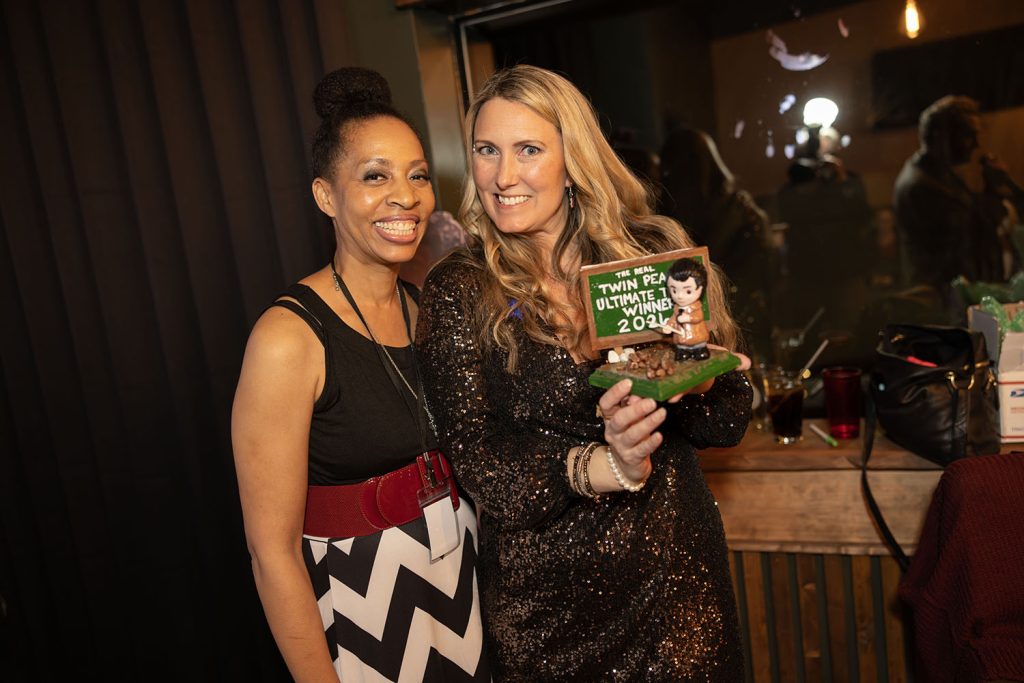 Charlene and Jessica with the ultimate trivia winner trophey