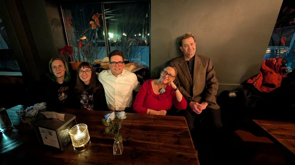 Group of people gathered in a bar