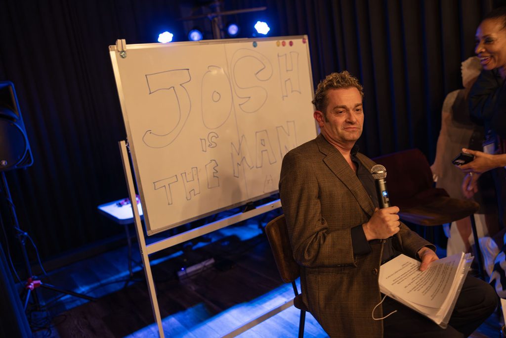 Josh is the man written on the white dry erase board