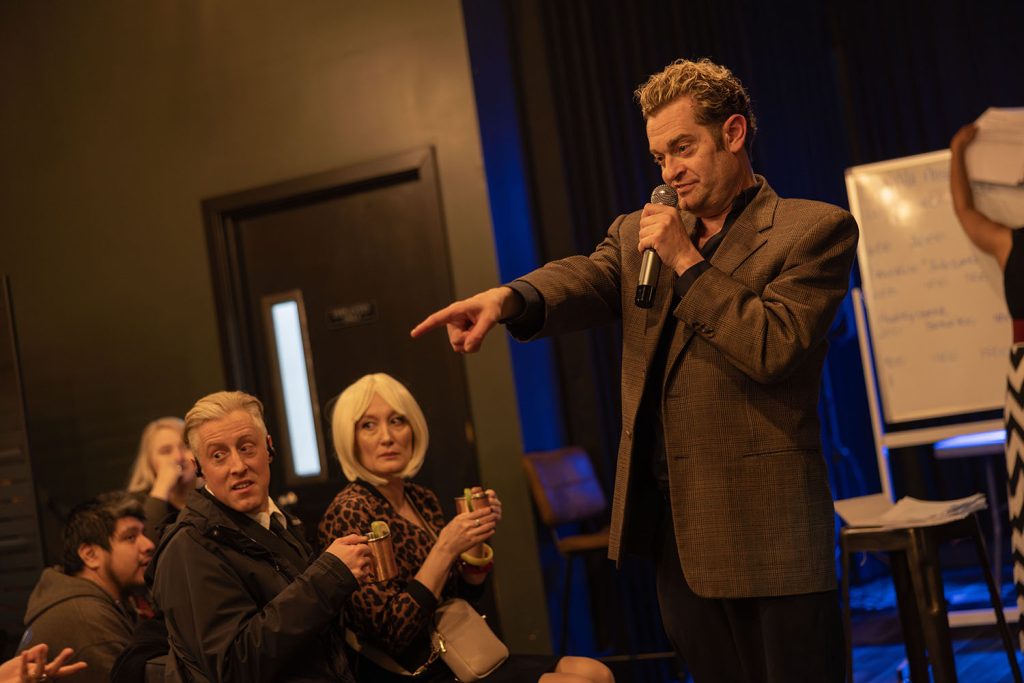 Josh pointing at contestants