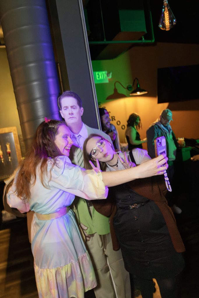 Two people taking selfies