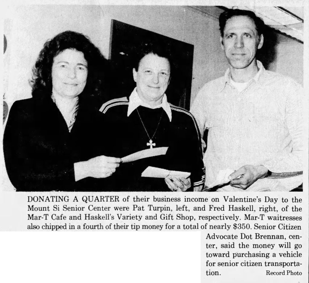 Newspaper article with an image of three people