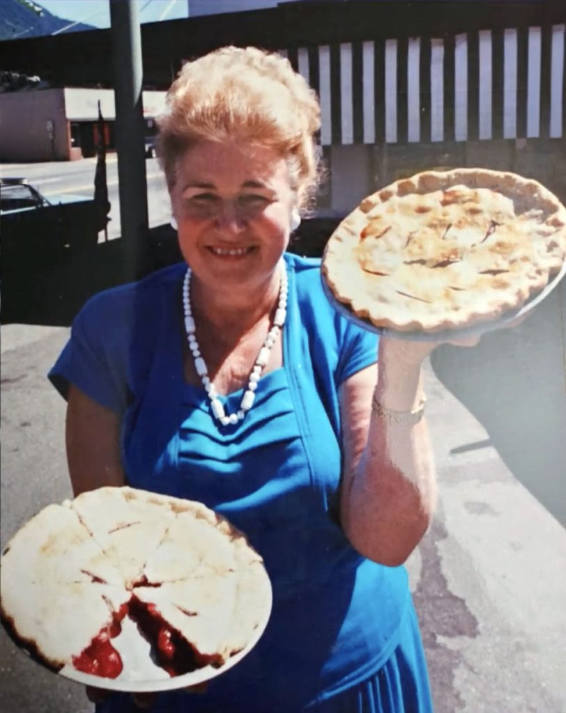Pat Cokewell holding pies outside the Mar-T Cafe