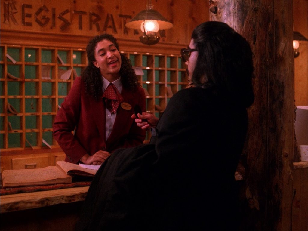 Louie and Mr. Tojamura at the Great Northern Hotel front desk