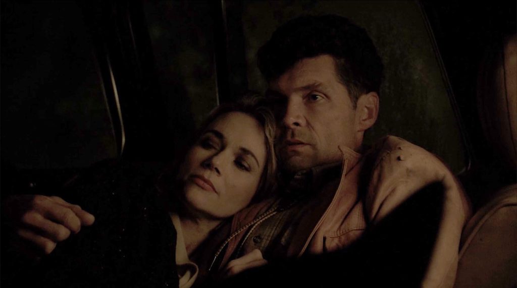 Norma and Ed sharing a moment in Ed's truck
