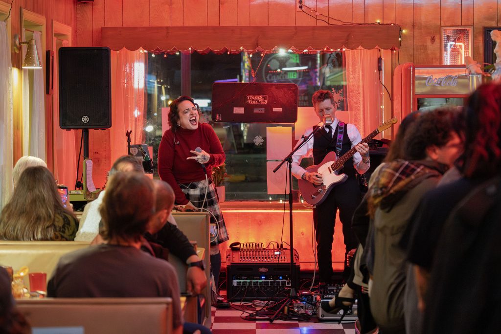 Wisteria Lodge singing in Twede's Cafe