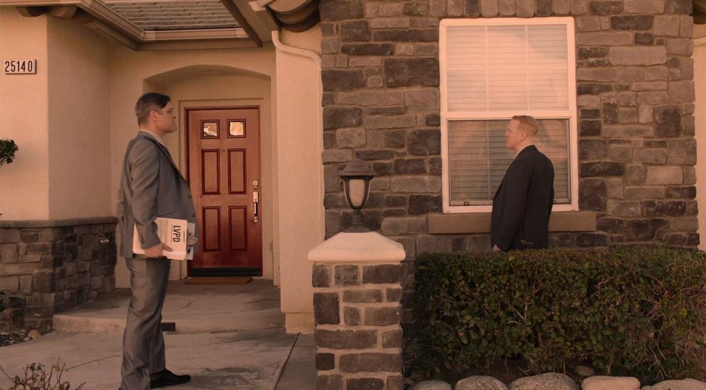 Agents Wilson and Headley outside the Jones' home