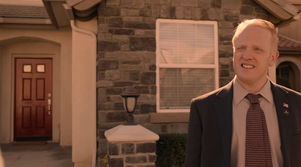 Agent Wilson outside the Jones' home